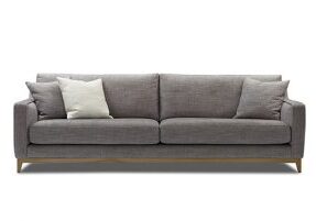 tan large sofa with an exposed timber base