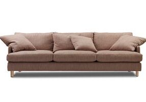 pink 4 seat sofa with cushions and timber feet